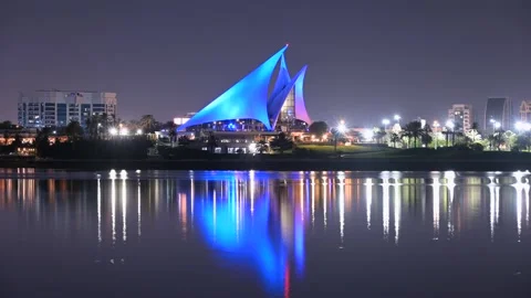 Time lapse of the distinctively sail-shaped illuminated clubhouse of Dubai Cr Stock Footage 146152400