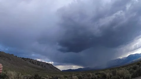 Time-lapse of a downpour of rain passing in front of the Sierra near Yosemite Video stock 166416466