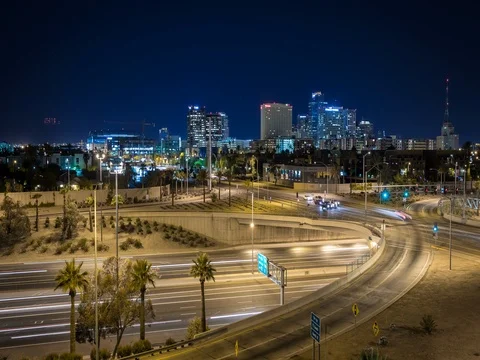 Time lapse of downtown Phoenix at night with freeway and air traffic. Stock Footage