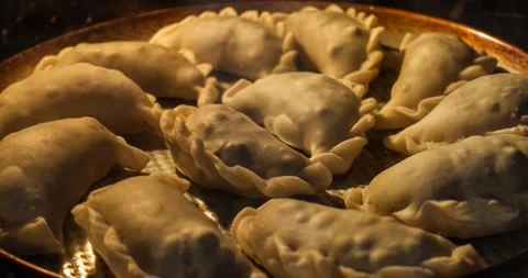 Time lapse of a dozen empanadas being baked inside an oven Stock Footage 148049086