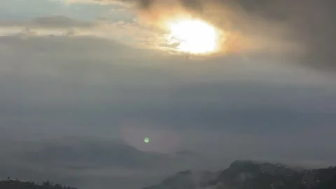 Time-lapse of Dramatic Clouds and Sunbeams with Lens Flare Effect. Video stock 327828168