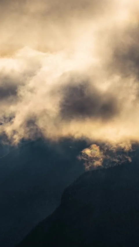 Time lapse of dramatic clouds motion fast in mystic winter mountains nature Stock Footage 231811098