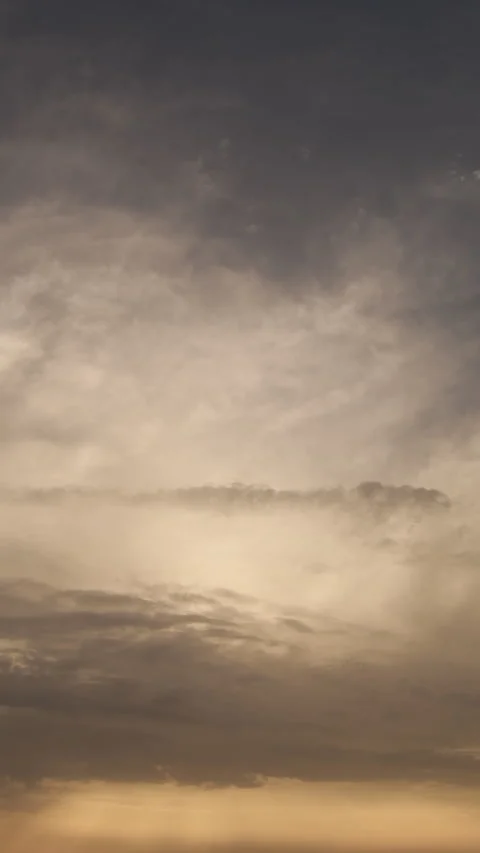 Time lapse of dramatic clouds moving across sky at sunset Stock Footage 344881342