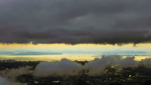 Time lapse of dramatic dark storm cloud flowing,  From dark sky to sunset. Stock Footage 77592929