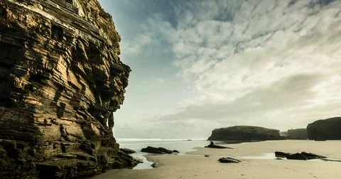 Time lapse with dramatic landscape, drifting clouds, water and rocks. Stock Footage 77918284