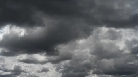 Time lapse of dramatic light to dark gray storm clouds moving across the sky. Stock Footage 273490769