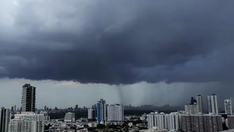 Time-lapse of a dramatic rain shaft descending from dark storm clouds Stock Footage 340472821