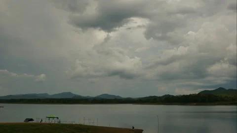 Time Lapse of Dramatic sky with stormy clouds over the lake Video stock 133430459