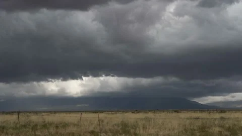 Time lapse of dramatic storm clouds over a desert mountain range Stock Footage 161903083