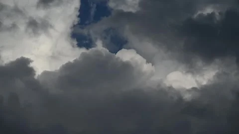 Time lapse of dramatic storm clouds boil in a summer sky as rain approaches Stock Footage 319595773