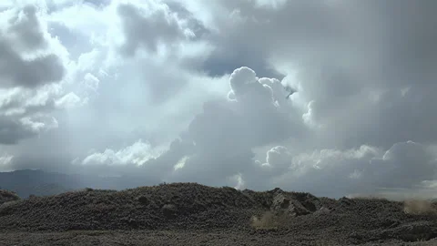 Time Lapse of Dramatic Storm Clouds Forming Over Mountain Landscape Stock Footage 329683368