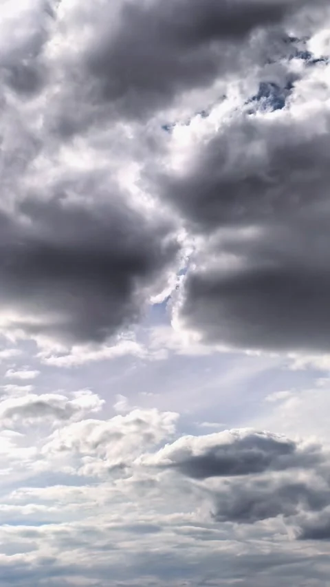 Time lapse of dramatic storm clouds with sun rays breaking through the sky, Stock Footage 339763139