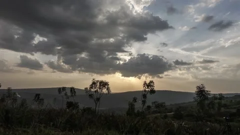 Time lapse of a dramatic sunset over rural fields and hills. Rwanda, Africa. Stock Footage 137347326