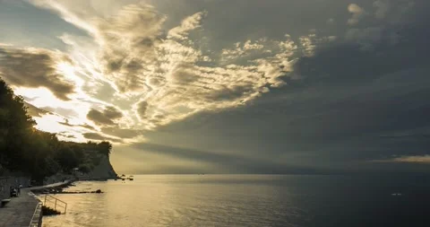 Time lapse of dramatic sunset over calm sea Stock Footage 138088703