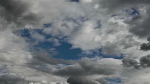 Time lapse of dramatic white clouds with a patch of blue sky. 스톡 동영상 139973896
