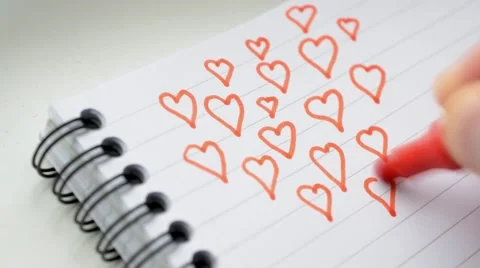 Time lapse of drawing many red heart shapes with felt pen Stock Footage 57461048