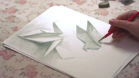 Time-lapse of drawing origami crane and dove Stock Footage 35138923