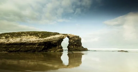 Time lapse with drifting clouds, water and rocks. Stock Footage 77917587