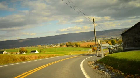 Time lapse of a drive through a hilly twisty road during glorious fall Stock Footage