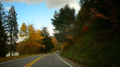 Time lapse of a drive through a hilly twisty road during glorious fall Stock Footage 20465107