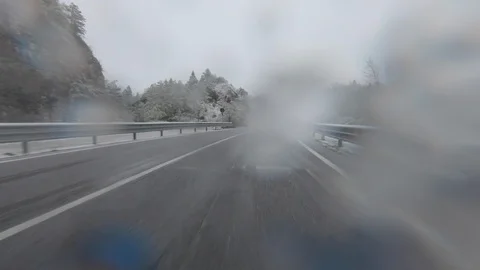 Time Lapse Driving a Car in a Winter Landscape with Snowy Road Stock Footage 112190402