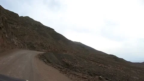 Time lapse: driving on a curvy mountain road by the sea in Jandia natural par Stock Footage 142007763