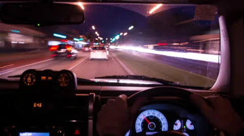 Time Lapse of driving at dusk with dashboard in focus 136GYND NTSC Stock Footage 26448255