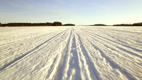 Time-lapse drone shot of rising above frozen lake Stock Footage 72814185
