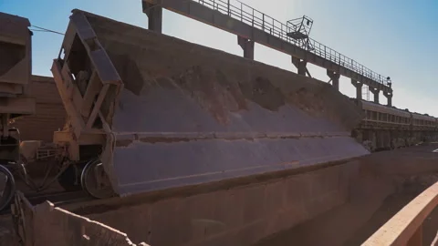 Time lapse of dump cars unloading ore at the crushing and sorting complex Stock Footage 91584189