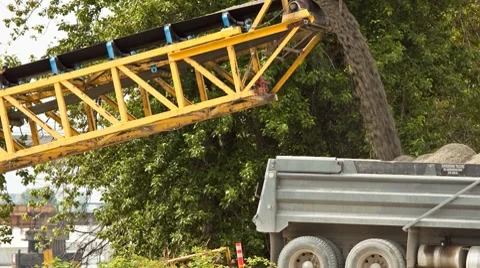 Time lapse of dump trucks being filled with gravel Stock Footage 8655413
