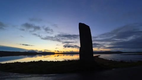 Time lapse of dusk at the watch stone in Stenness in Orkney in 4K Video stock 297279994