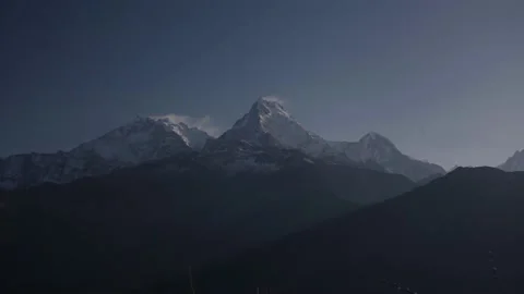 Time-lapse Dust of snow blowing on Mountain before Sunrise landscape Stock Footage 154018497