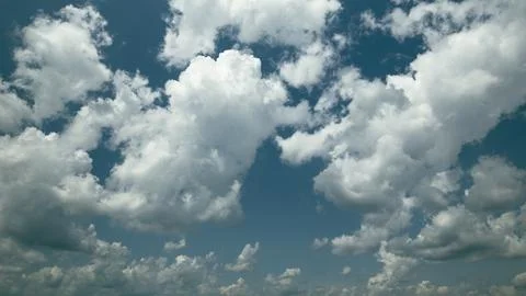 Time lapse. Dynamic Cloud Patterns Gracefully Floating Under a Bright and Beauti Stock Photos