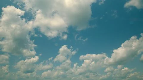 Time lapse. Dynamic Cloud Patterns Moving Gracefully Across a Bright and Lively Stock Photos
