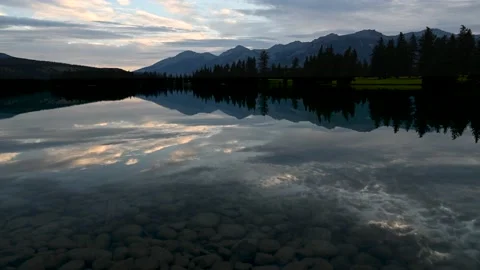Time lapse of early morning clouds above a chain of mountains Stock Footage 139659866