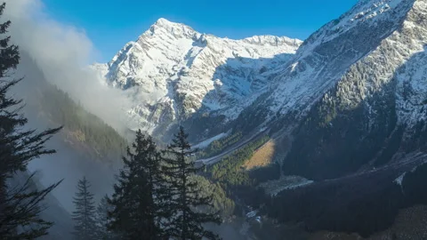 Time lapse, early snow in the mountains. Snowy mountains view. Swiss Alps. .. Video stock 255802032
