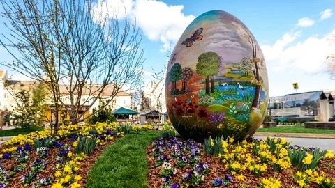 Time Lapse - Easter Egg at an Easter market with people and clouds passing by Stock Footage 99367409