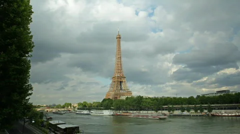 Time-Lapse of Eiffel Tower across River Seine on Partly Cloudy Day in Paris Stock Footage 827168