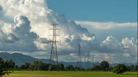 Time lapse electric high voltage pylon against sky Stock Footage 68521173