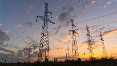 Time lapse - Electricity pylons at sunset. Transmission towers Stock Footage 79026985