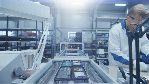 Time Lapse of Electronics Factory Workers Assembling Circuit Boards by Hand Stock Footage 104047864