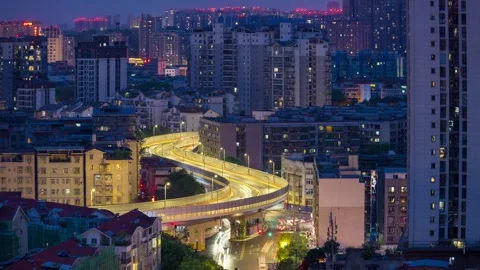 Time-lapse of an elevated highway running through dense residential buildings. Stock Footage 332629315