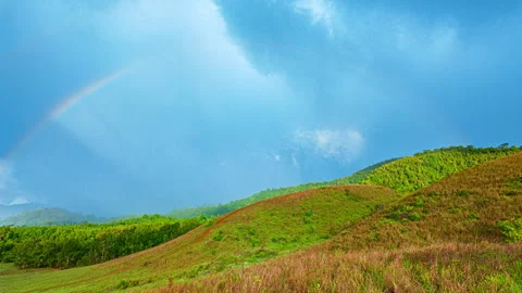 Time lapse Elevated View of Forested Hills and rainbow Stock Footage 341291068