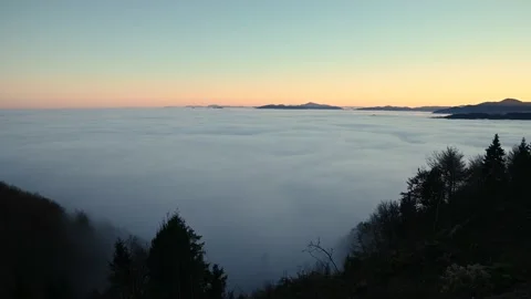 Time lapse elevated view of inversion clouds moving over Ljubljana basin Stock Footage 143826938