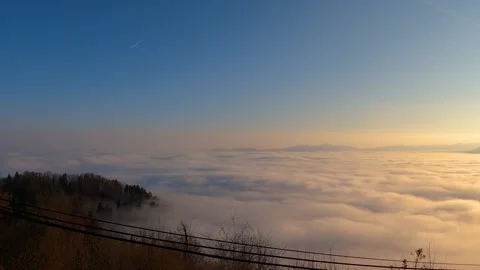 Time lapse elevated view of inversion clouds moving in the valley, Slovenia Stock Footage 144094174