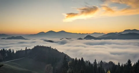 Time lapse elevated view of low inversion clouds moving in the valley Stock Footage 142883449