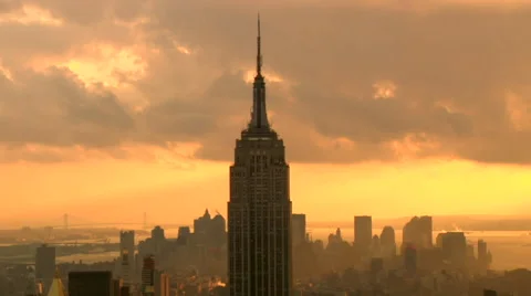  Time Lapse Empire State Building Yellow Orange Clowdy Stock Footage 49221779