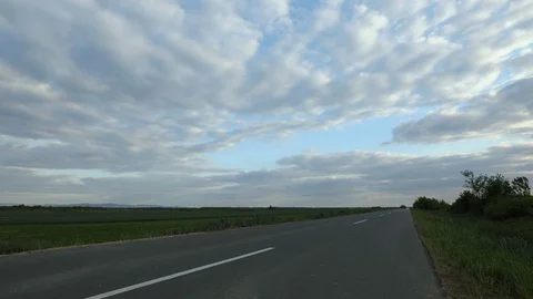 TIME LAPSE - an empty asphalt road between the fields Stock Footage 129877142