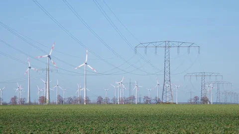 Time lapse Energy Landscape with Wind Turbines and Electricity Pylon Видео 73483550