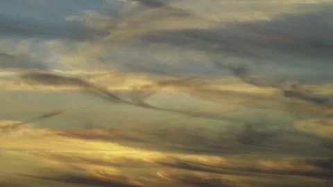 Time-lapse of ethereal clouds moving fast across a pastel coloured sunset sky. Stock Footage 340142455